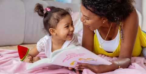 Cheerful young mother communicating with her daughter